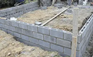 Professionals building a foundation with blocks in Birmingham, AL