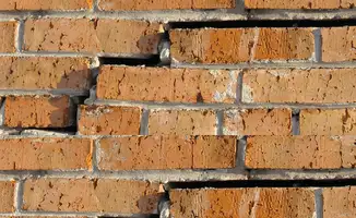Brick wall with serious structural damage in Birmingham, AL
